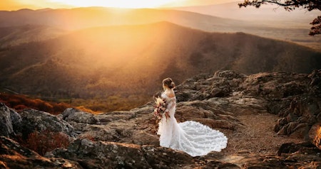 Bride wearing sexy wedding dress Edison by Maggie Sottero on a mountain at sunset.