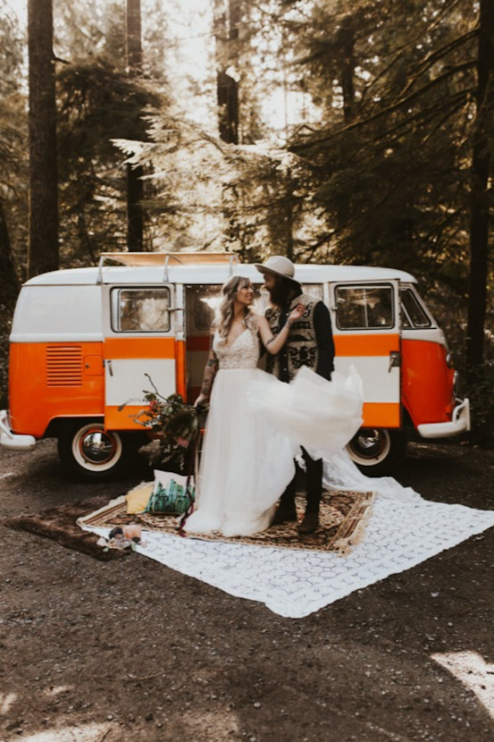 Groom and Bride wearing Charlene wedding dress by Maggie Sottero in front of an orange and white van